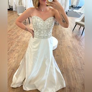 Size 12 light mocha colored wedding dress. A-line styled gown with beaded bodice